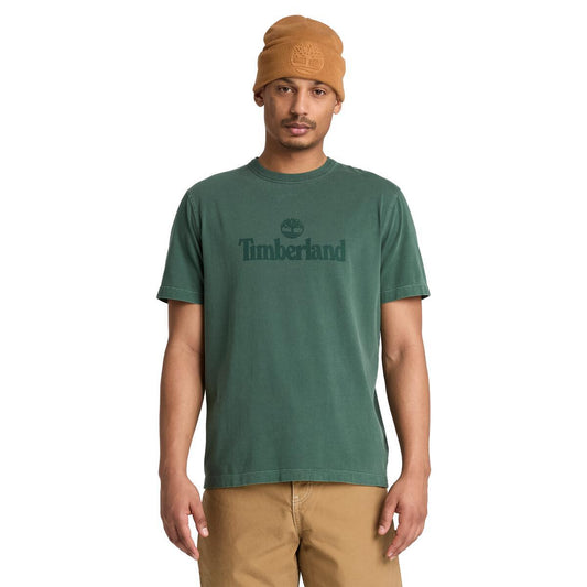 Green tee with Timberland logo on person