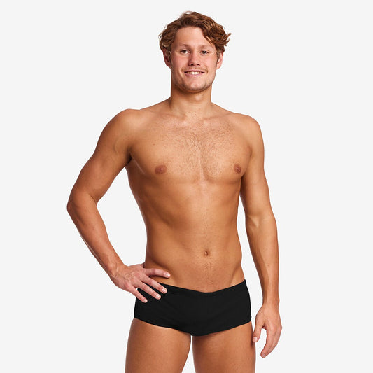 Front view on model, solid black square-cut trunk with drawcord waistband