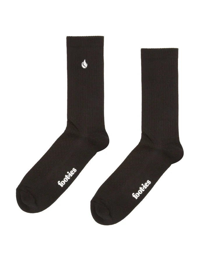 Pair of black foot-ies Blaze sneaker socks showing white foot-ies branding and a white flame logo.