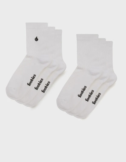 Three pairs of white foot-ies Blaze half crew socks with black foot-ies branding and a black flame logo.