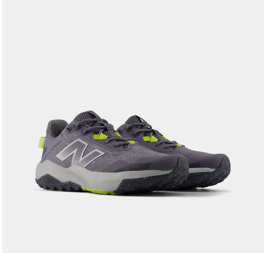 Pair of grey and black New Balance Big Kids Nitrel Lace trail running shoes with bright yellow accents on the lace loops and outsole, shown at a three-quarter angle against a light grey background.
