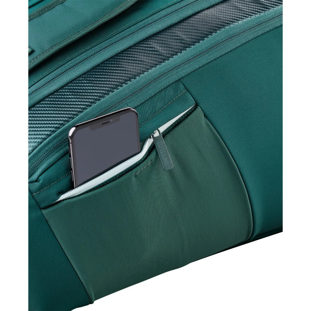 Close-up of a phone in the green Wilson Blade V10 bag’s small zipped exterior pocket.