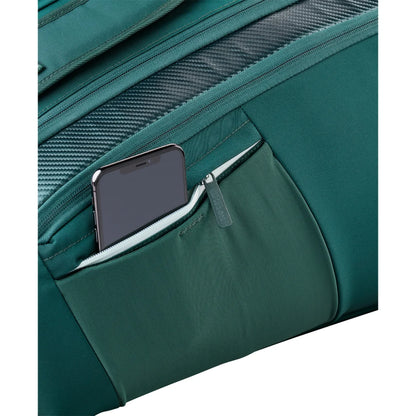Close-up of a phone in the green Wilson Blade V10 bag’s small zipped exterior pocket.