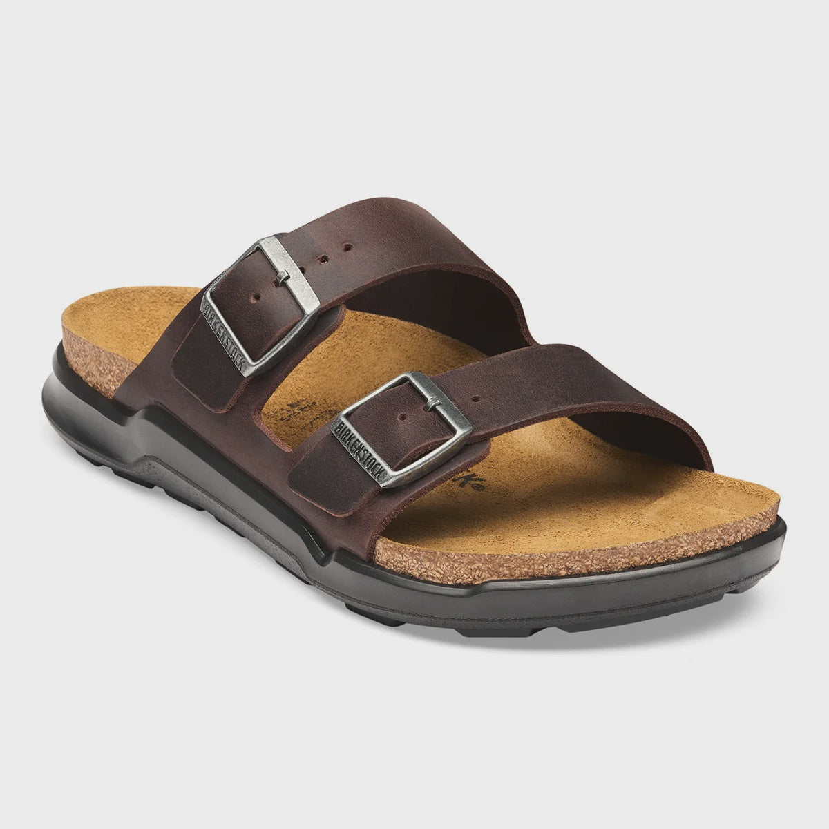 Birkenstock Women's Arizona CT sandal in Habana dark brown oiled leather featuring two adjustable silver buckle straps, a cork-latex footbed, and a durable black polyurethane outsole.