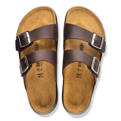 Top-down view of a pair of Birkenstock Arizona CT sandals in Habana dark brown oiled leather, featuring two adjustable silver buckle straps and suede-lined cork footbeds on a white background.