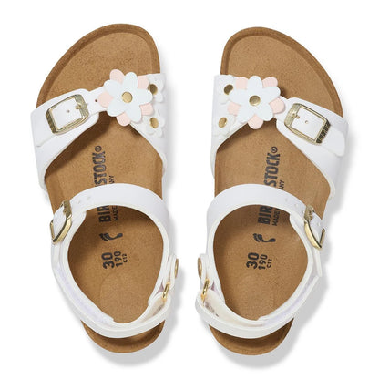 A pair of Birkenstock 3.0 Kids sandals in white, featuring decorative white and pink flower accents on the straps and adjustable buckles, shown from a top-down view on a white background.