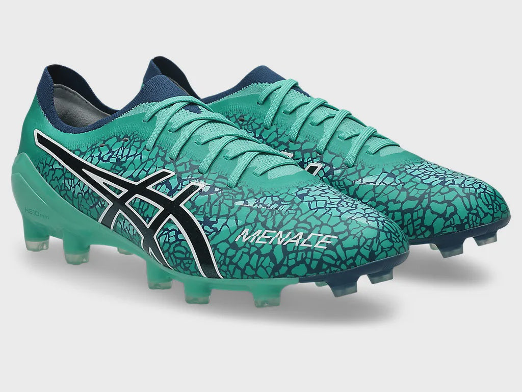 Side profile of a single ASICS Menace 5 football boot in Aurora Green with a dark blue crackle pattern, showcasing the black and white side logo, molded studs, and dark blue sock-like ankle collar.