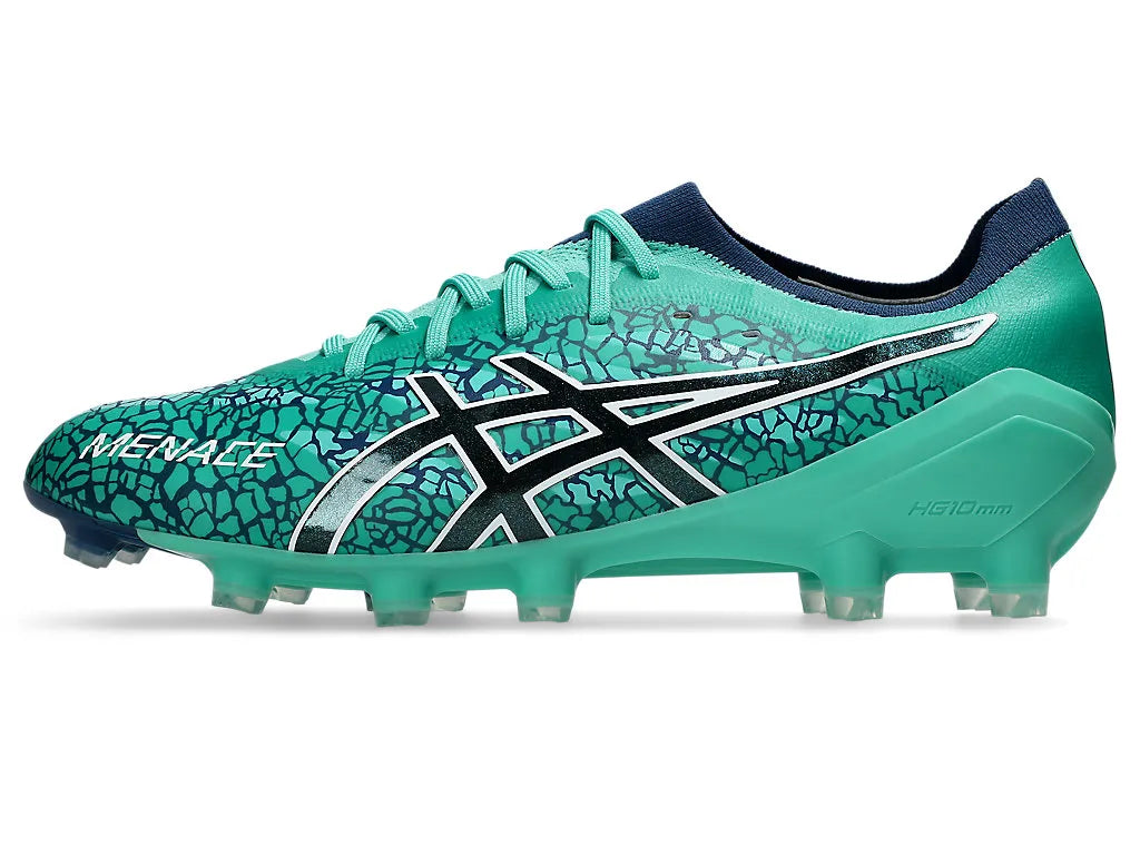Side profile of a single ASICS Menace 5 boot in Aurora Green with a dark blue crackle pattern, showcasing the black and white side logo, "MENACE" branding near the toe, clear studs, and dark navy sock collar.
