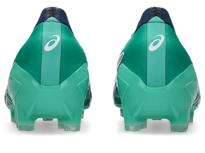 Rear view of a pair of ASICS Menace 5 boots, showing the Aurora Green upper, light green heel counters with white ASICS logos, dark navy ankle collars, and molded studs.