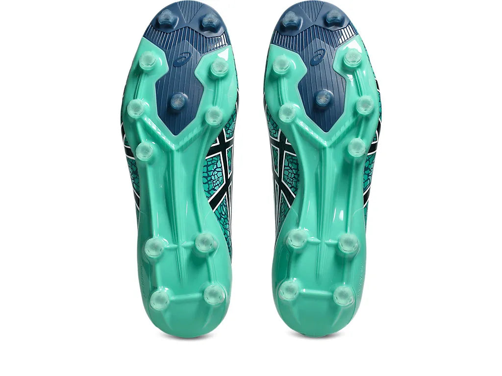 Bottom view showing the outsoles of a pair of ASICS Menace 5 boots, highlighting the Aurora Green and Twilight Blue sole design with clear molded studs and midfoot support ribs.