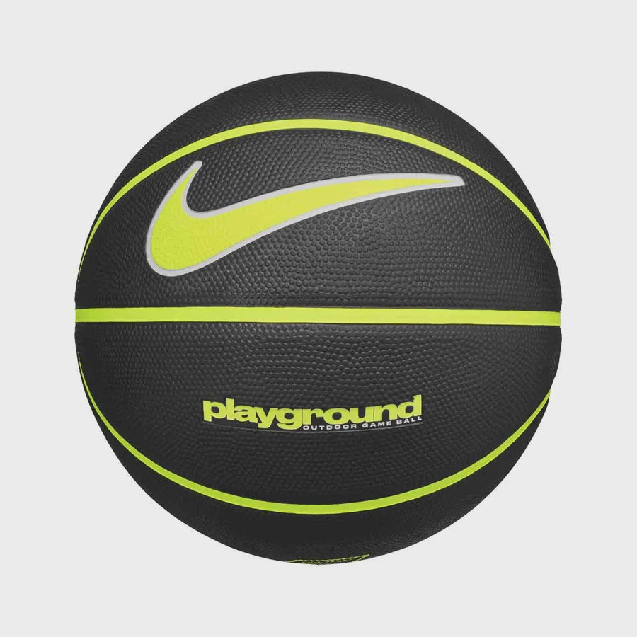A black Nike playground basketball with neon yellow-green accents, featuring the Nike swoosh and 'playground' text, set against a light gray background.