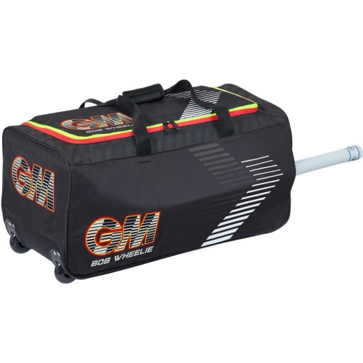 Black Gunn & Moore Rival 606 Wheelie Cricket Bag featuring red and yellow neon graphics, prominent orange GM logos on the side and end pocket, all-terrain wheels, top carry handles, and a cricket bat handle extending from the side bat sleeve.