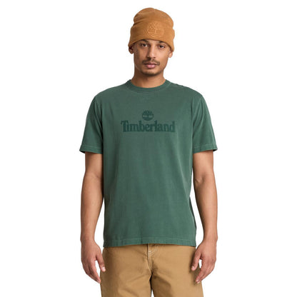 Green tee with Timberland logo on person